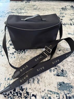 Matt & Nat Black Crossbody Baby Bag with Branded Strap